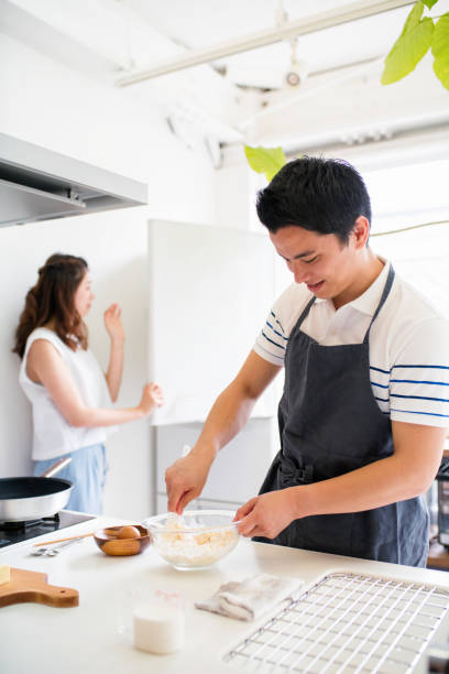 istock Young couple cooking together 647623410