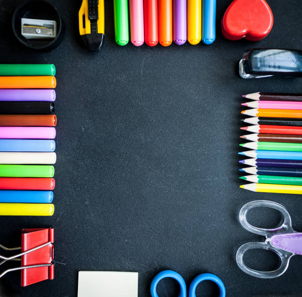 istock stationery flat lay on black chalkboard 647626080