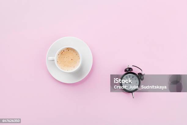 Alarm Clock And Morning Coffee Time To Rest Flat Lay Stock Photo - Download Image Now