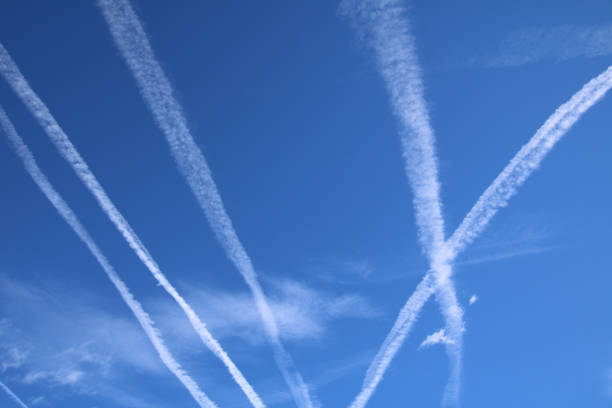 istock Vapor Trails in the blue sky 647626806