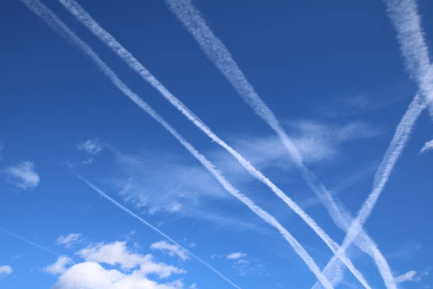 istock Vapor Trails in the blue sky 647626904