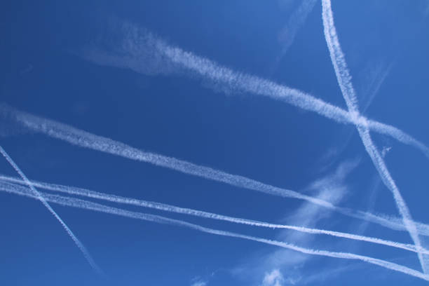 istock Vapor Trails in the blue sky 647627348