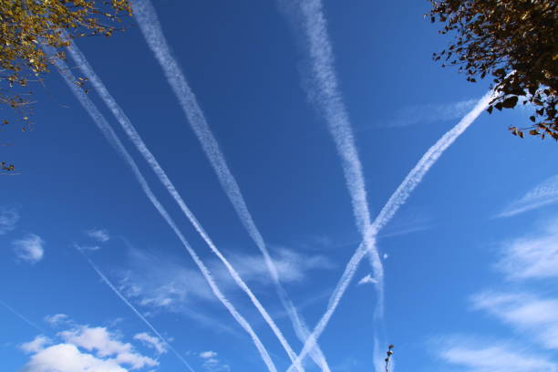 istock Vapor Trails in the blue sky 647627460