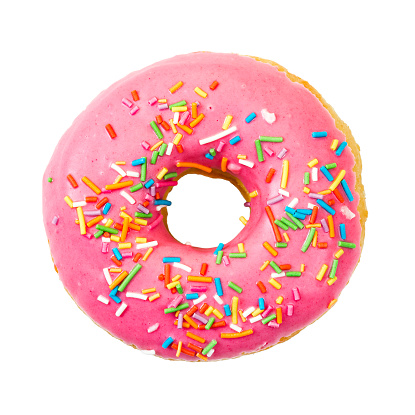 Donut with colorful sprinkles isolated on white background. Top view.
