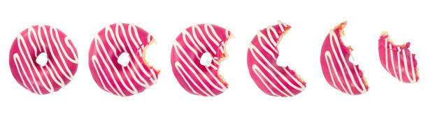 istock Eaten donut with pink icing and white stripes 647649814