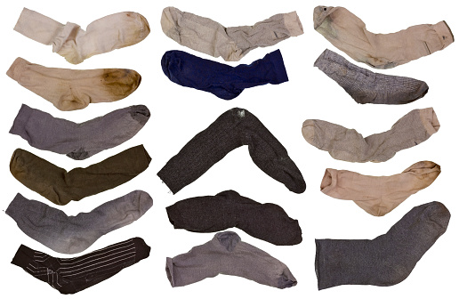 The old worn fragmentary but purely washed by  retro men's socks set. Isolated collage from several photos