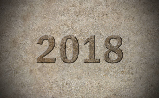 istock 2018 year sign carved out in stone 647659514