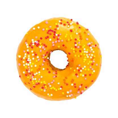 Donut with orange glaze and colorful sprinkles isolated on white background. Top view.