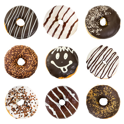 Set of chocolate donuts isolated on white background. Top view.