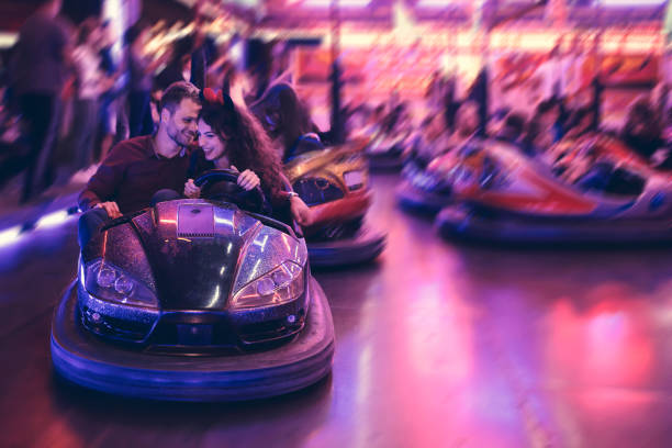 istock Love birds in bumper car, fair 647661506