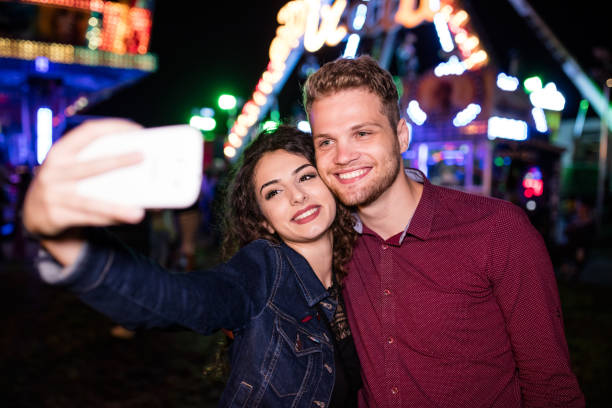 istock Selfie as a proof for surviving the scariest ride, amusement park 647661682