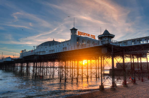 Brighton Pier Brighton Pier at sunset in December east sussex photos stock pictures, royalty-free photos & images