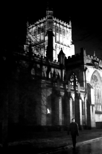 Bristol Cathedral viewed at night in black and white with the tower picked out by search lights.