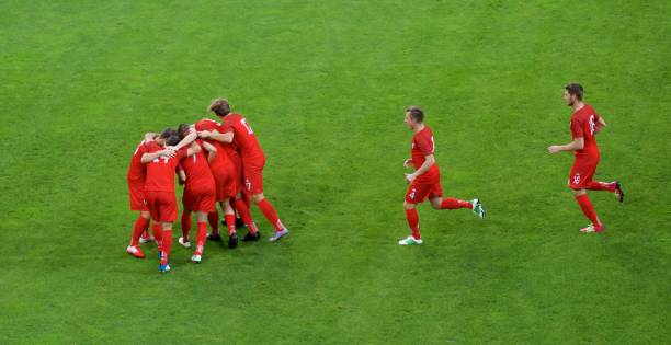 istock Football players celebrating 647672088