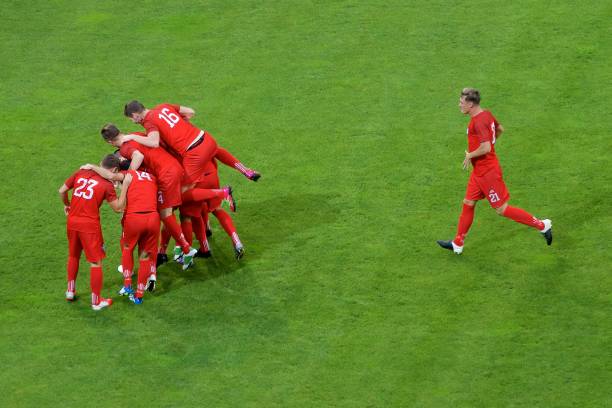 istock Football players celebrating 647672106