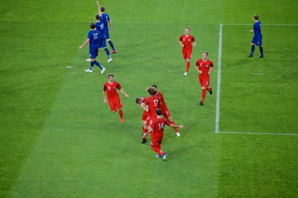 istock Football players celebrating 647672124