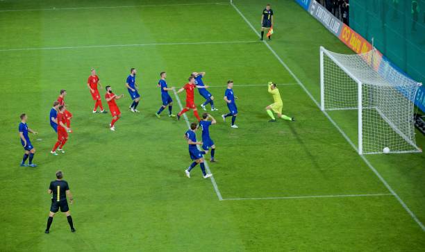 istock Football players scoring a goal 647672150