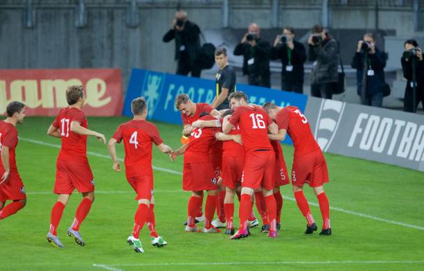 istock Football players celebrating 647672216