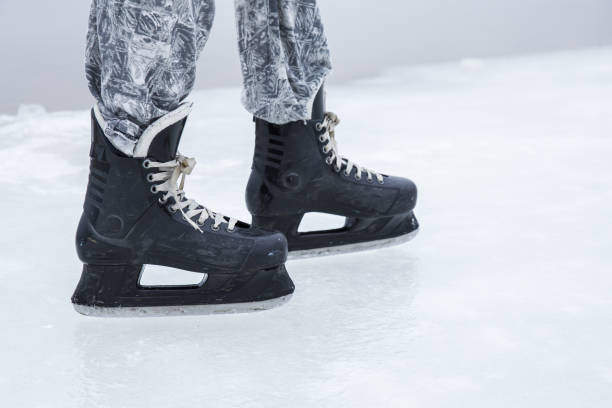 istock Man skating and training with black skatess. Weekends activities outdoor. 647673024