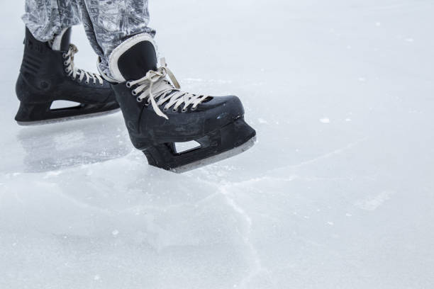 istock Man skating and training with black skatess. Weekends activities outdoor. 647673082