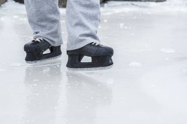 istock Man skating and training with black skatess. Weekends activities outdoor. 647673222