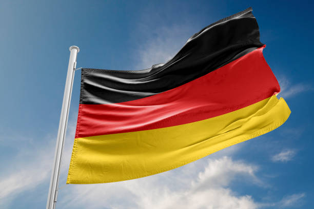 istock German Flag is Waving Against Blue Sky 647676204