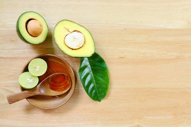 istock Fresh avocado fruits on a wood background. 647677210