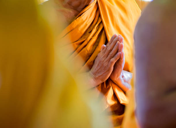 istock Closeup Hand Pray of Thai Monk. 647677770