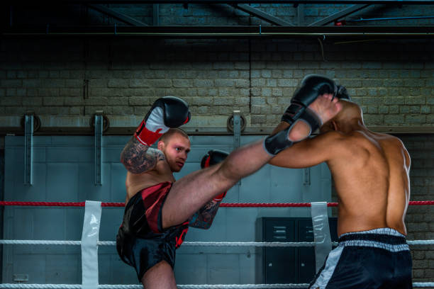 istock Boxers free fighting in boxing ring 647680832