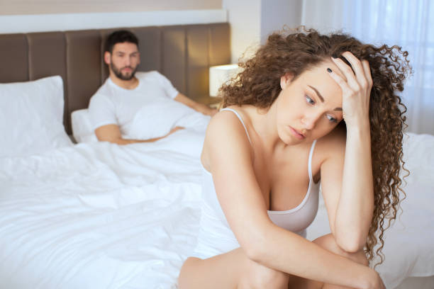 istock Sad couple on bed after fight 647688322