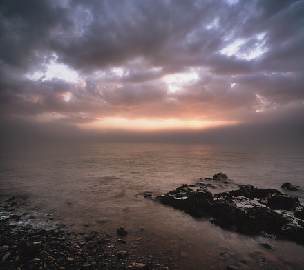 A colourful sunset washes over the Bay of Fundy coast of Nova Scotia.