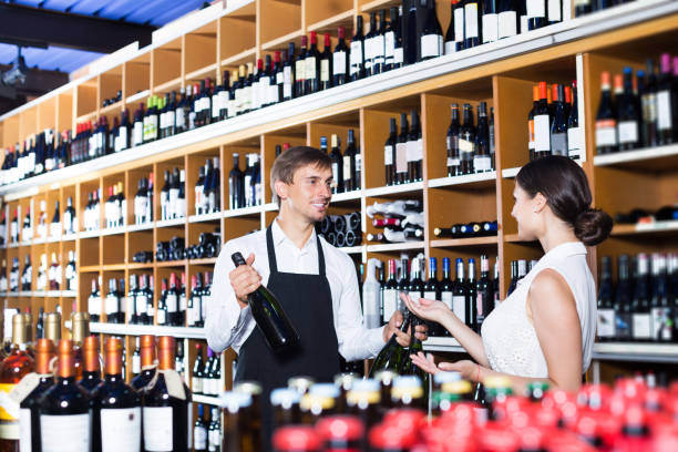 istock Seller helping to buy bottle 647695012