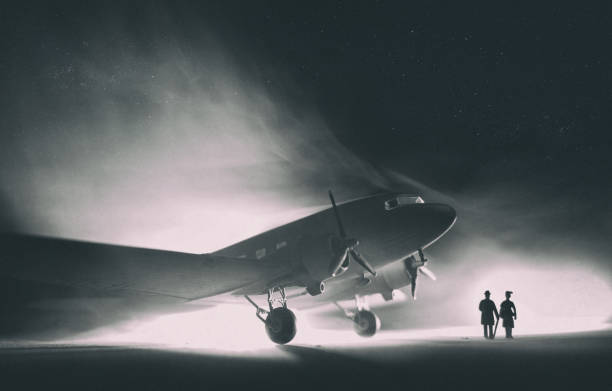 DC-3 Dakota In The Fog, Model Photography With the fog closing in, two passengers prepare to board a vintage DC-3 Dakota. Miniature and models photographed in a studio environment. film noir style photos stock pictures, royalty-free photos & images