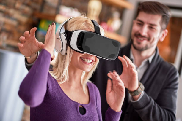 istock Woman wearing VR headset 647699594