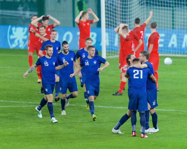 istock Soccer players celebrating 647702212