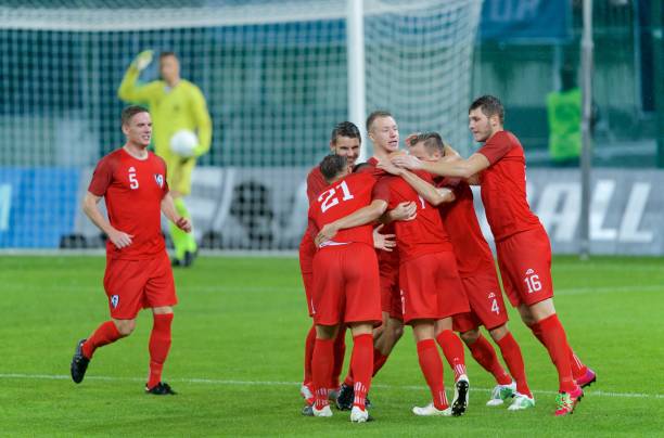 istock Football players celebrating 647702220