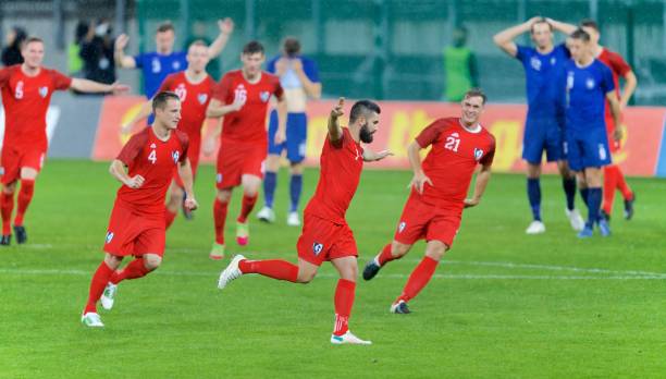 istock Soccer players celebrating 647702224