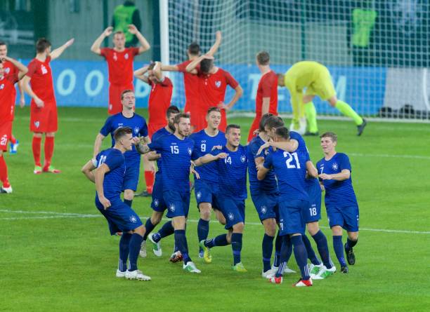 istock Soccer players celebrating 647702228