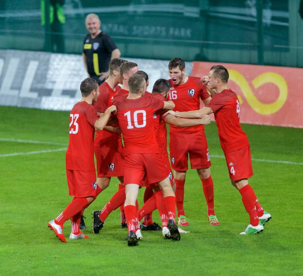 istock Football players celebrating 647702240