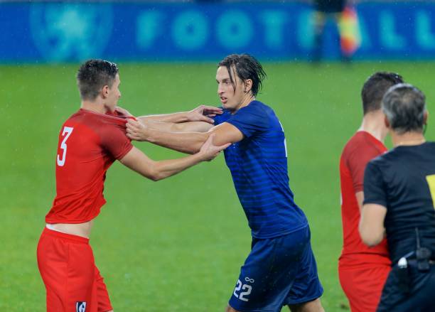 Soccer players arguing Two football players arguing with each other during match. soccer player fight stock pictures, royalty-free photos & images