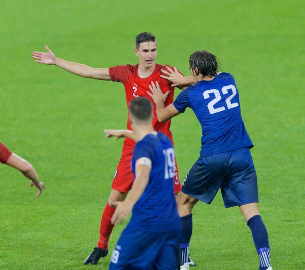istock Soccer players arguing 647702312