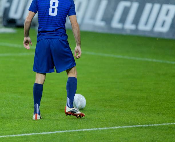 istock Football player with ball 647702360