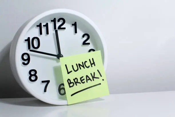 Photo of Lunch break note on office clock