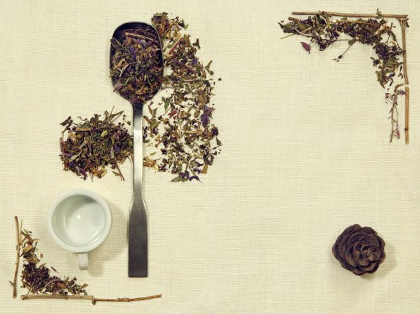 istock Herbal flat lay of different herbs on linen fabric with a spoon, cup and pine cone 647707938