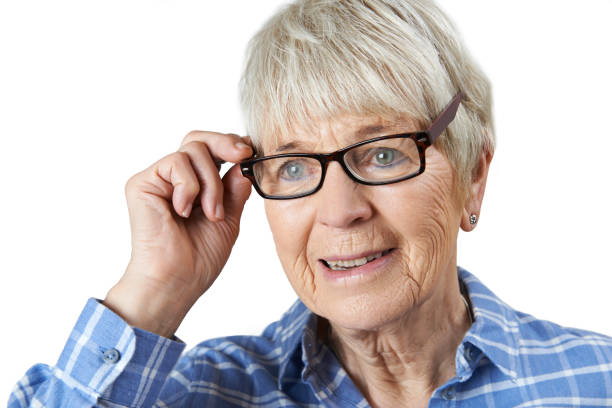 istock Senior Woman Trying On New Glasses 647714618