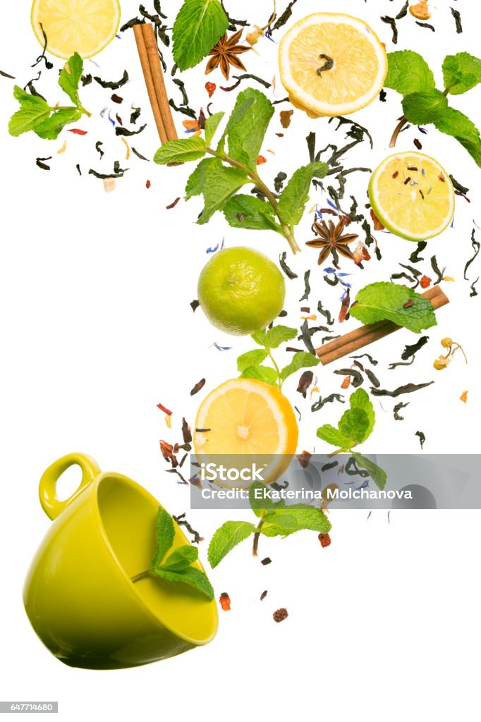 Tea falling down to the cup. Levitating tea. Concept of tea Tea falling down to the cup. Levitating tea. Concept of tea. Fantasy tea. Isolated on white. Vertical Tea - Hot Drink Stock Photo