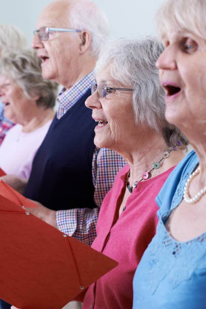 istock Group Of Seniors Singing In Choir Together 647715106