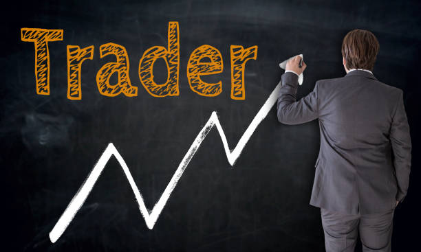 istock Businessman writing trader on blackboard concept 647721886