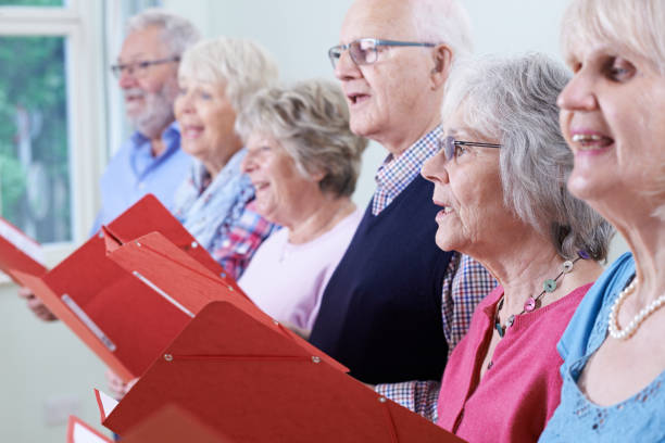 istock Group Of Seniors Singing In Choir Together 647725028