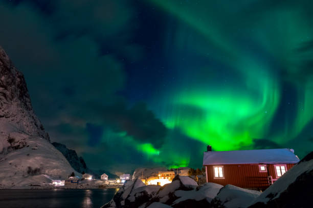 istock Northern Lights over Norwegian Houses 647725030